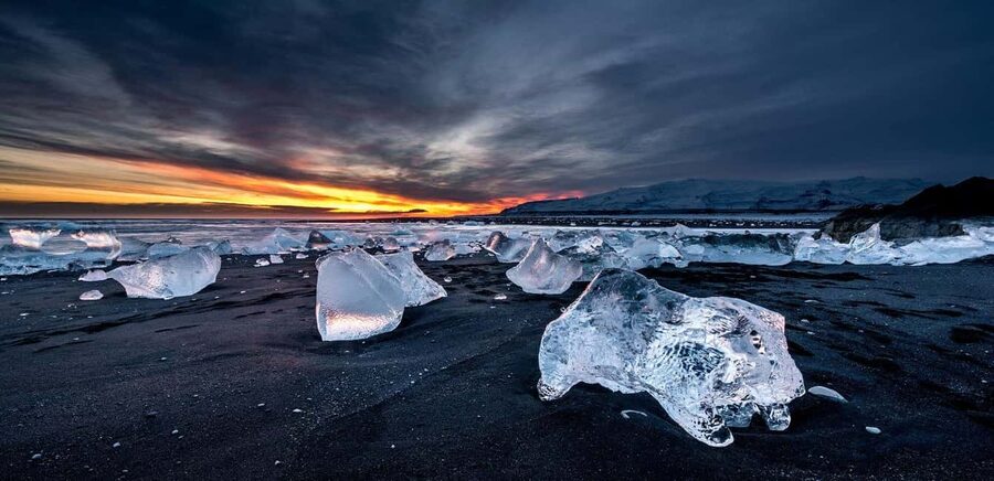 2-Day South Coast, Blue Ice Cave, Glacier Lagoon Tour - Diamond Beach puts ice on black sand