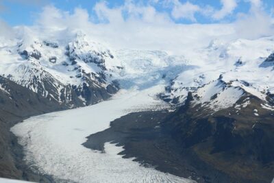 Airplane flight over glacier lagoons and Iceland’s highest peak