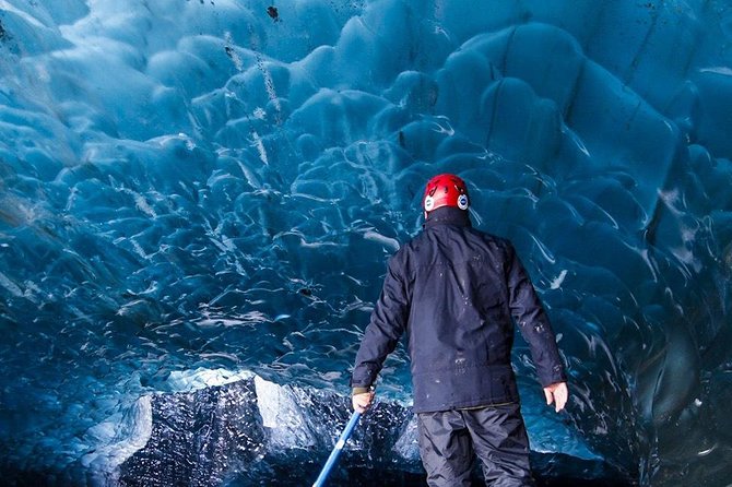 Crystal Blue Ice Cave Adventure - Putting on crampons and entering the ice