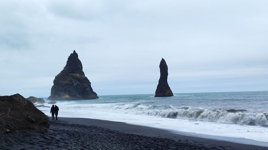 From Reykjavik 2-Day South Coast Tour with Blue Ice Cave - Reynisfjara: black sand, basalt, and serious water