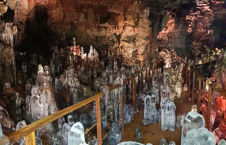 From Reykjavik: Lava Caving Tour - Walking through the volcanic passage