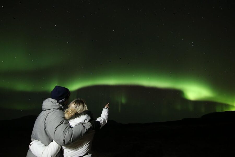 From Reykjavik: Northern Lights Tour with Hot Cocoa & Photos - What Happens at the Photo Stops