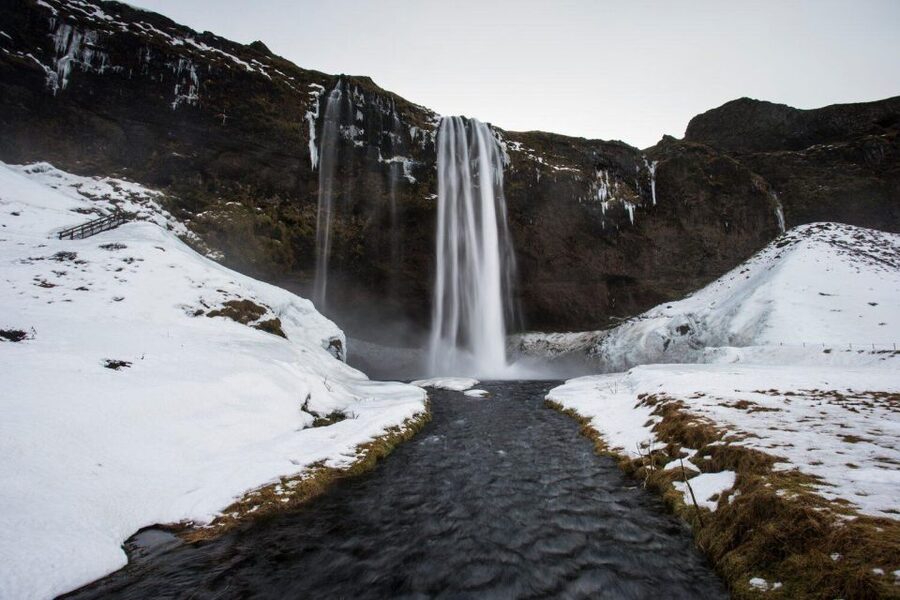 From Reykjavik: South Coast Tour & DC-3 Plane Wreck - Sólheimajökull, blue ice beside black volcanic ground