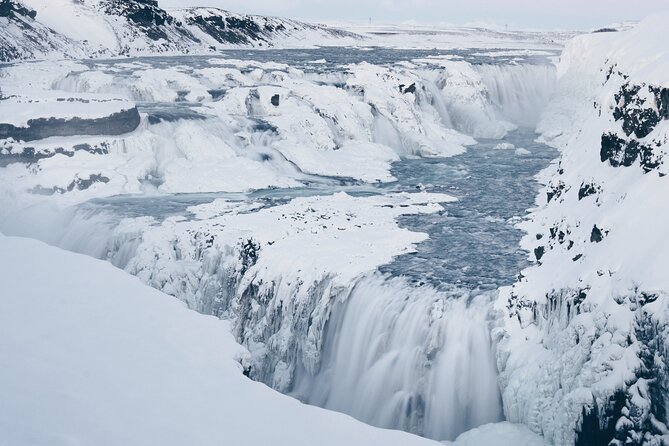 Golden Circle and Kerid Minibus Tour with Blue Lagoon Transfers - Waiting for Strokkur to erupt every 7 to 10 minutes