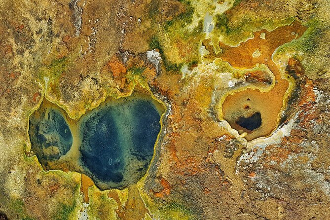 Helicopter Flight Over Geothermal Landscapes from Reykjavik - Craters, lava fields, geysers, and steam