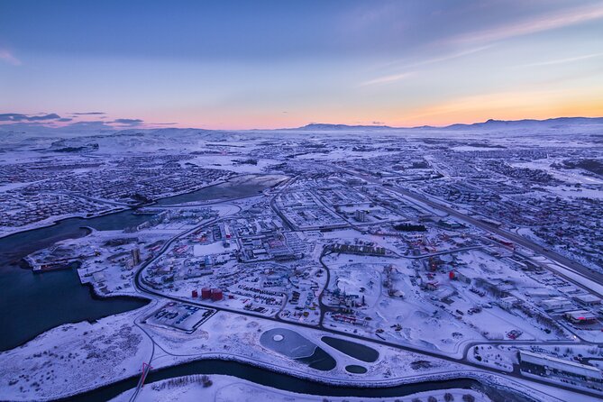 Helicopter Tour with Mountain Summit Landing from Reykjavik - Leaving the summit and flying over Reykjavik again