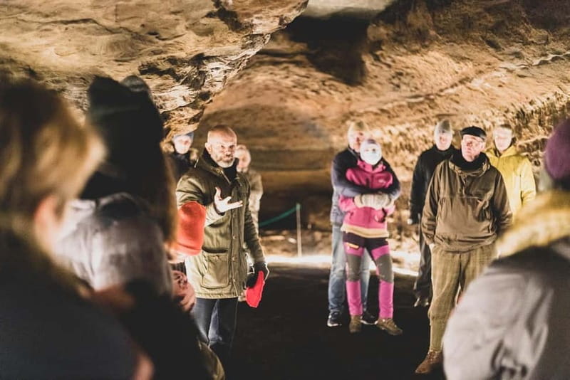 Hella: Guided Tour of Ancient Man-Made Caves - Crosses, carvings, and seats inside the caves