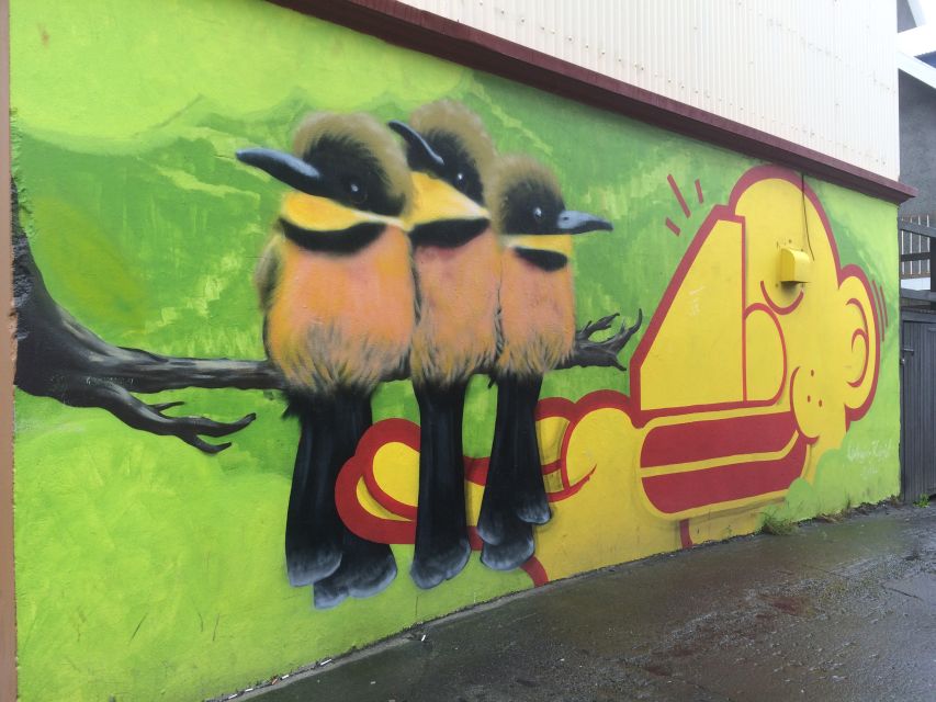Reykjavik: Guided City Walking Tour - Tjornin, local snacks, and a welcome pause