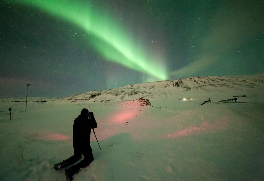 Reykjavik: Northern Lights Group Tour with Photos - Chasing clear skies instead of following a fixed route