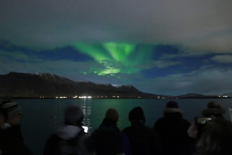 Reykjavik: Northern Lights Guided Boat Tour with Photos - Leaving Reykjavik Old Harbour After Dark