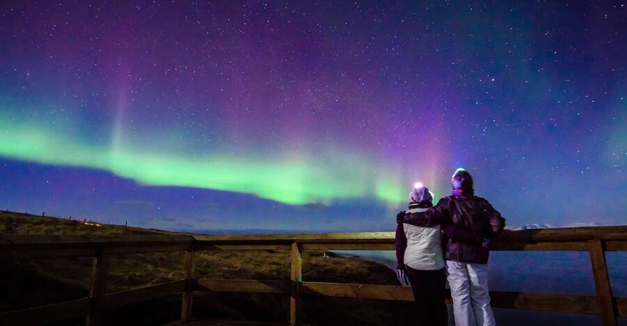 Reykjavík: Northern Lights Minibus Tour with Photos - Hunting for a clear patch of sky