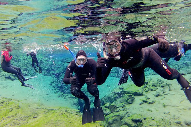 Silfra Drysuit Snorkeling with Free Photos - Meet on Location - Getting into the drysuit