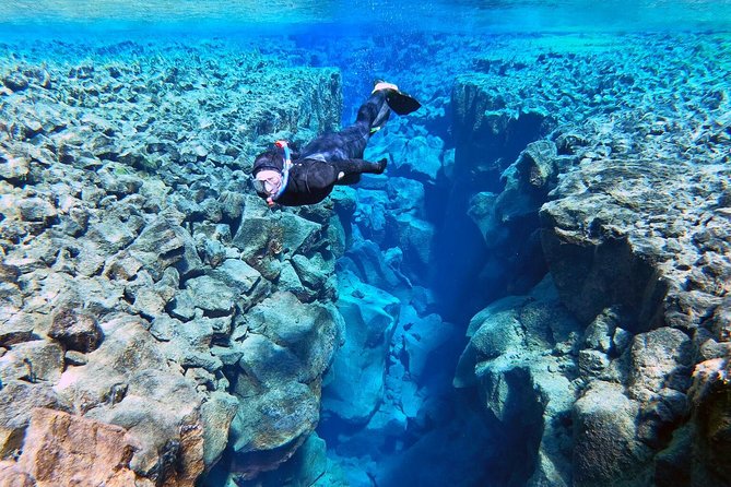 Silfra Wetsuit Snorkeling - Meet on Location | Free Photos - The safety briefing and your first minutes in Silfra