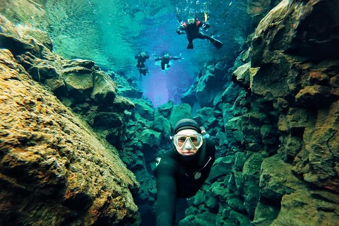Silfra Wetsuit Snorkeling - Meet on Location | Free Photos - Floating through the fissure between two plates