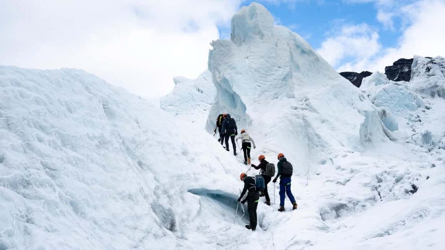 Skaftafell: Glacier Hike & Ice Climbing Adventure - Looking into crevasses and ice formations