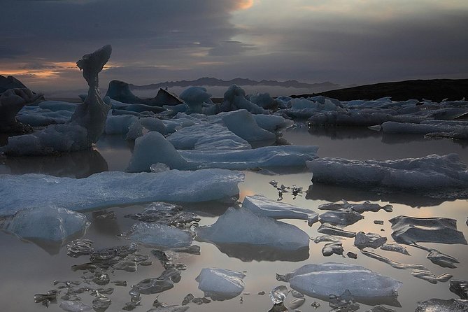 South Coast and Glacier Lagoon Day Trip by Super Jeep from Reykjavik - Dyrhólaey and Reynisfjara show Iceland’s dark coast