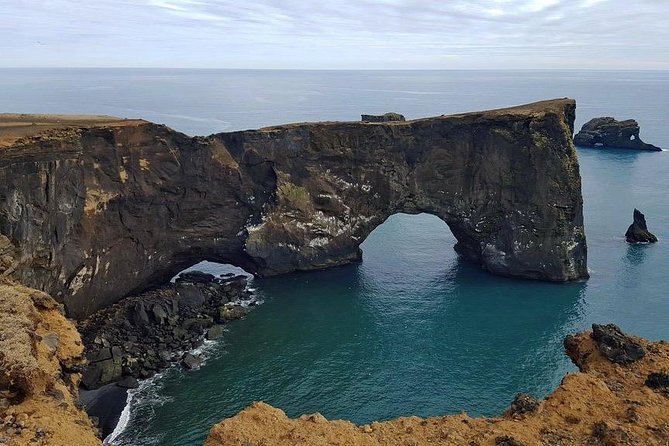 South Coast. Private Day Tour from Reykjavik - Dyrholaey: cliffs, sea, and glacier views